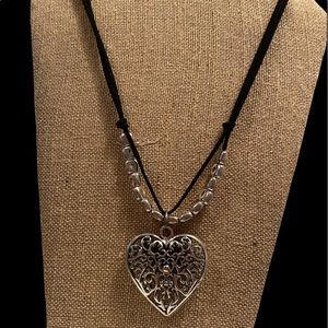 Leather and silver heart necklace.
